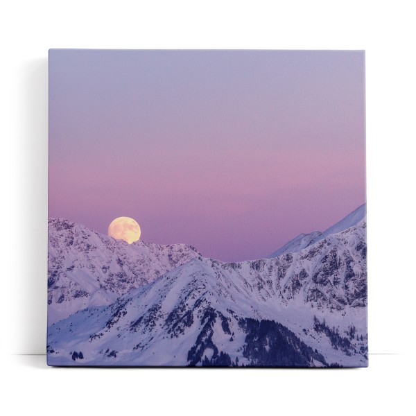 Vollmond hinter Bergen Berggipfel Mond Schnee Gebirge